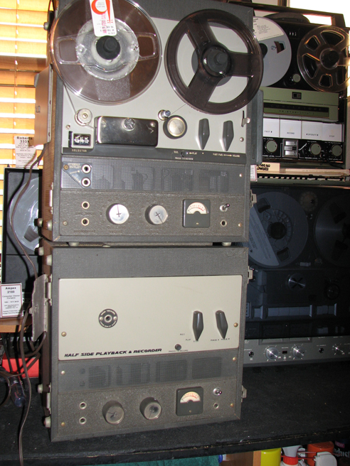 Vintage reel-to-reel tape recorder on the scrap pile